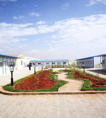 Completed modular workforce camp with rows of prefabricated units and paved walkways